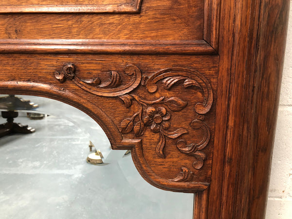 Antique French Oak Louis XV style mantle/trumeau mirror. It has its original mirror and is in good original detailed condition.