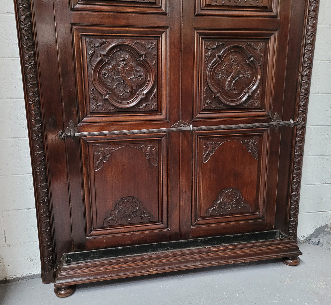 French Henry II 19th century narrow proportioned Walnut hall stand. Full of Character with stunning hand forged wrought iron hooks and interesting carvings. In good original detailed condition.