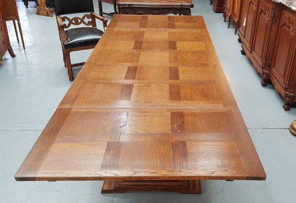 A beautiful French oak, Spanish style parquetry top extension table, with amazing carving and lovely details in very good condition.