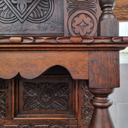 Impressively carved 18th Century English Oak kitchen dresser in 17th Century Jacobean style. It is in good original detailed condition and has been sourced from France.