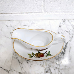 Royal Worcester "Evesham" Pattern small Jug and Saucer.  Good Condition no cracks or chips.  Please see photos as they form part of the description.