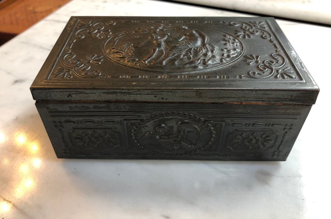 Vintage Cedar & metal box with decorative scene of cupid and a lady. Is in good original condition.