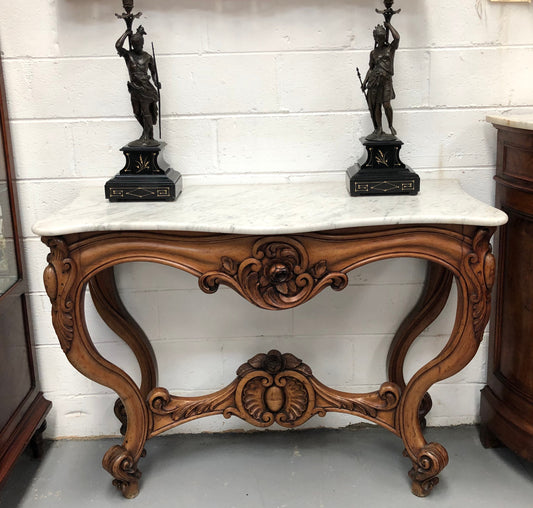 19th Century Louis XV style beautifully carved console table. With detailed ornate carving and a beautiful marble top. In good original detailed condition.