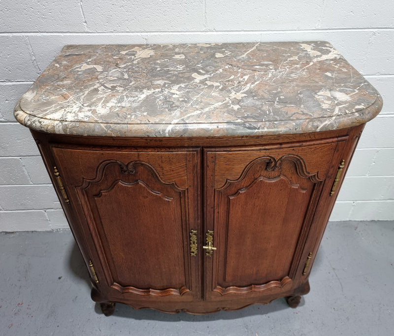 Rare 19th Century French Oak and marble top oval buffet / cabinet. Stunning thick marble top and decorative handles. In good original detailed condition.