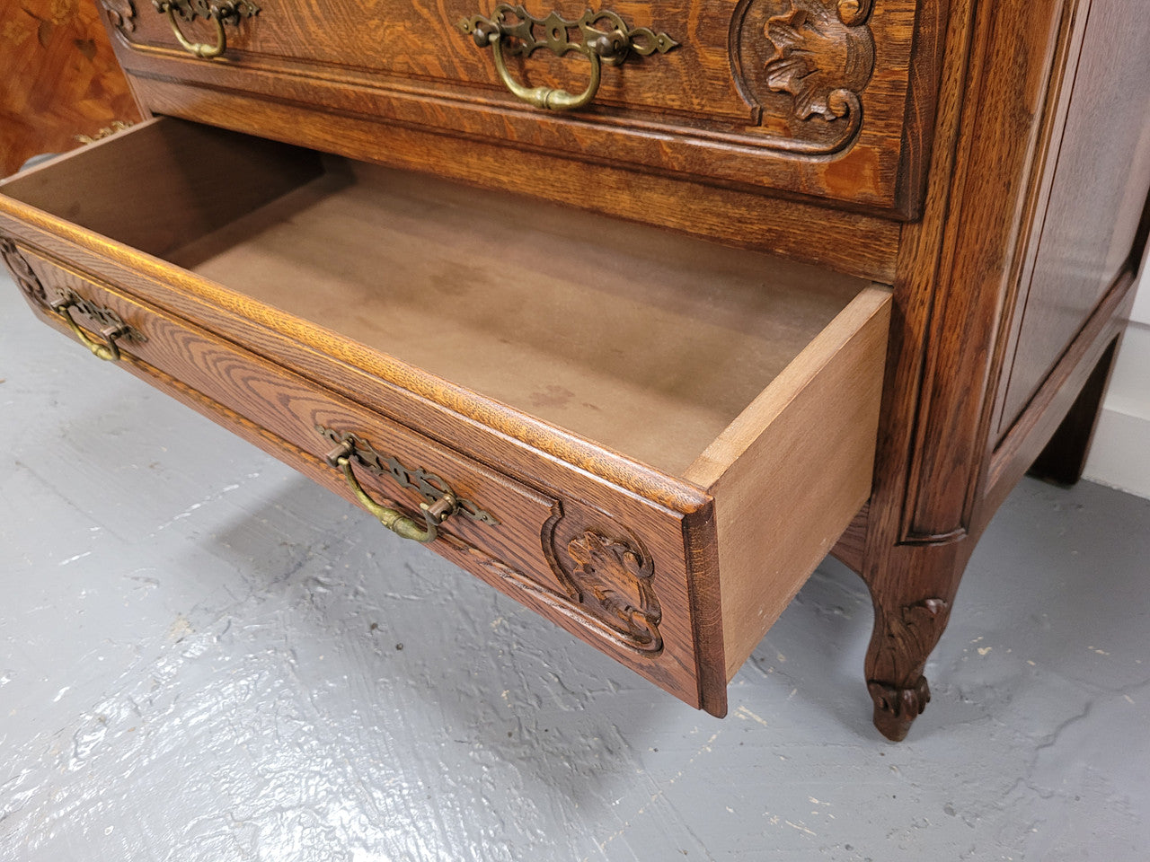 French Louis XV style Oak three drawer chest with wooden top. It has been sourced from France and is in good original detailed condition.