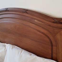 Fabulous French Walnut queen size bed with lovely detail and comes with custom made slates. It is in good original detailed condition.