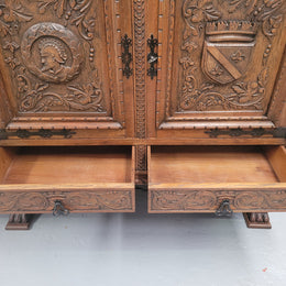 Large French Oak Renaissance style four door sideboard/buffet. Great decorative item with amazing carvings and stunning iron work on base. It is in good original detailed condition. Can pull apart completely making it easier to move.