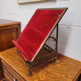 Antique French brass Gothic Revival book stand with red velvet. It has sourced from France and is in good original condition.