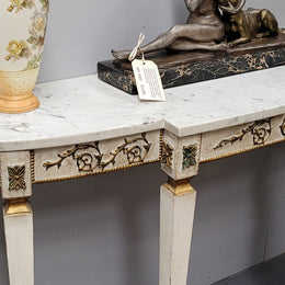 French Louis XVI style painted marble top console table. It is of pleasing narrow proportions and has been sourced from France. It is in good original detailed condition.