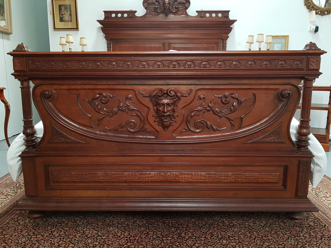 Grand French Henry II style Mahogany queen size bed. Very detailed carvings and comes with custom made bed slats, simply just put your mattress on top. In very good condition.