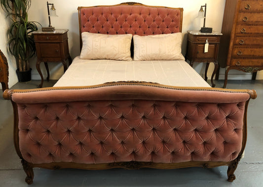 Beautiful upholstered French walnut queen size bed. This bed has lovely carved detail and custom made slats in very good condition.