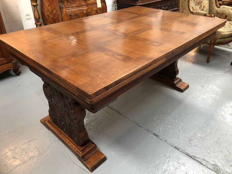A beautiful French oak, Spanish style parquetry top extension table, with amazing carving and lovely details in very good condition.