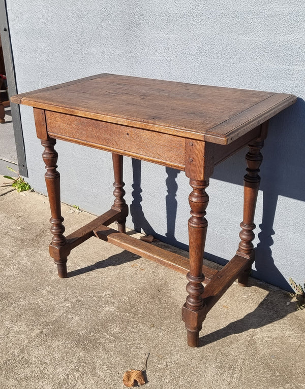 Rustic French Oak side table/desk with turned legs. In good original condition.