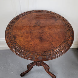 Rare early Victorian Irish Burr Walnut wine table. It has a beautiful carvings and a stunning burr walnut top, on a barley twist column and three shaped legs. It has been sourced locally and is in good original detailed condition. We also have a second table being sold separately which when together make a matched pair.