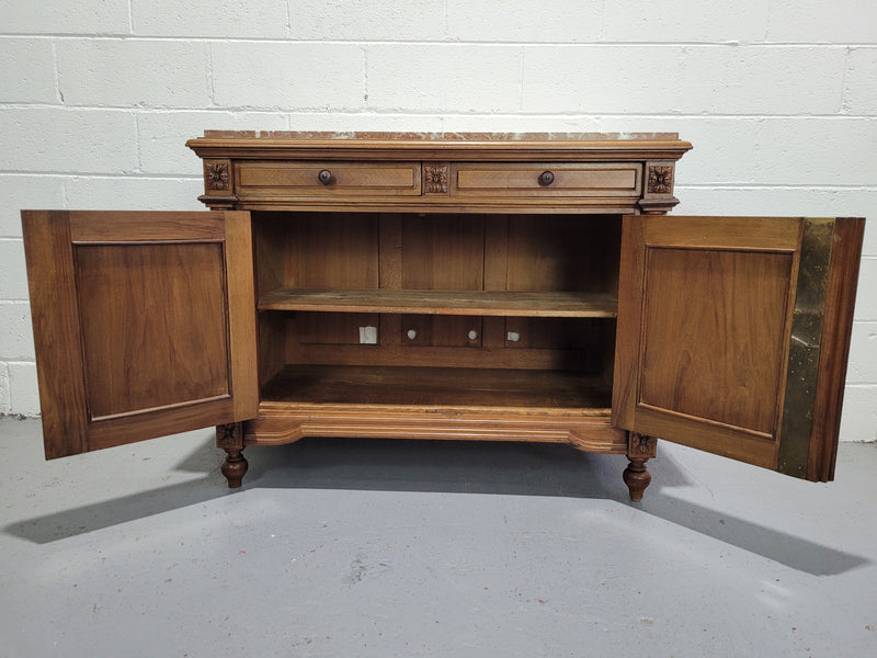 Stunning French walnut Henry II style marble top side cabinet with two drawers and two shelves inside. In good original detailed condition.