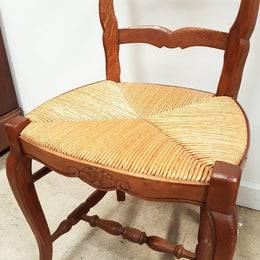 A set of six French Louis XV style, ladder back oak chairs. With finely carved detail and rush seat. In great original condition. Chairs are comfortable and sturdy for everyday use.