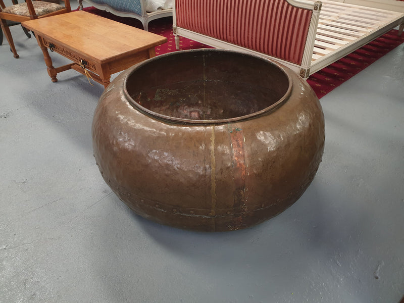 Rare & unique huge Antique copper cauldron and is stamped Melbourne. This cauldron originally would of been used to make chocolate. This would make an ideal gardern feature piece as a planter or as a fountain.