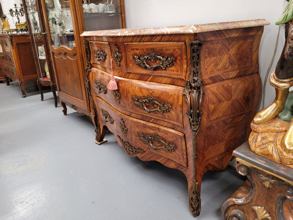 Beautiful French Louis XV style Kingwood inlaid marble top four drawer commode. It has decorative mounts and has been sourced from France. It is in good original detailed condition.