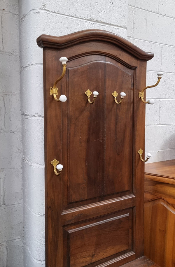 Lovely entrance piece with shelf and single door cupboard, topped with a section for hanging jackets, hats etc. Sourced from France and in good original detailed condition.
