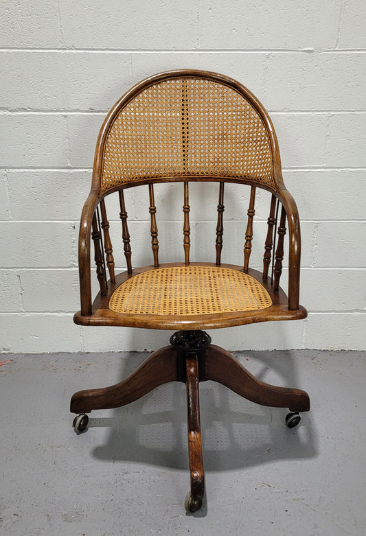 Elm Bentwood and cane swivel desk chair. In good original detailed condition and is comfortable to sit in.