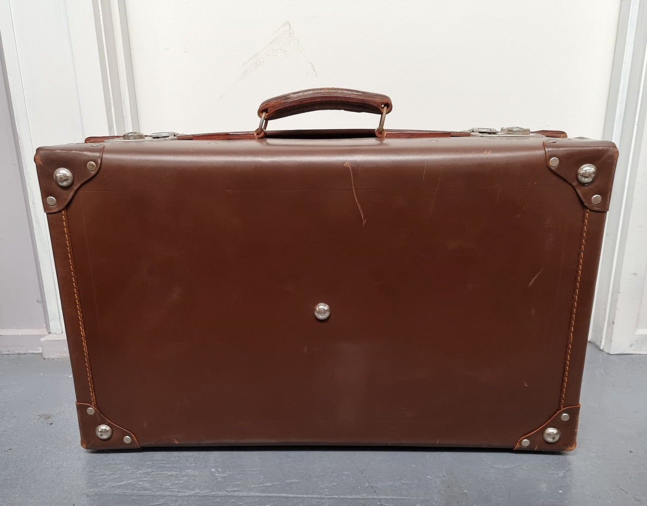 Impressive solid leather suitcase, moire fabric lined with leather straps to hold contents. Displays gold initials F.S.A near handle. With key. Please view photos as they help form part of the description.