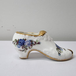 A lovely pair of Royal Albert China shoes in good original condition. Stamped on the sole 'Moonlight Rose: Royal Albert Bone China, England ©1987.