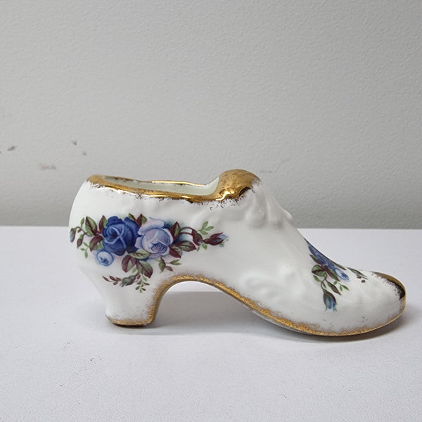 A lovely pair of Royal Albert China shoes in good original condition. Stamped on the sole 'Moonlight Rose: Royal Albert Bone China, England ©1987.
