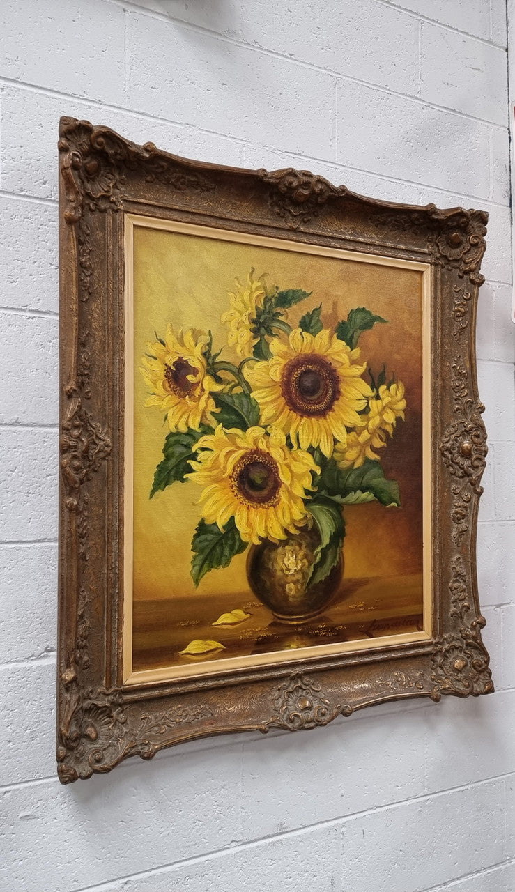 French signed oil on canvas depicting sunflowers in an attractive gilt frame. It is in good original detailed condition and has been sourced from France.