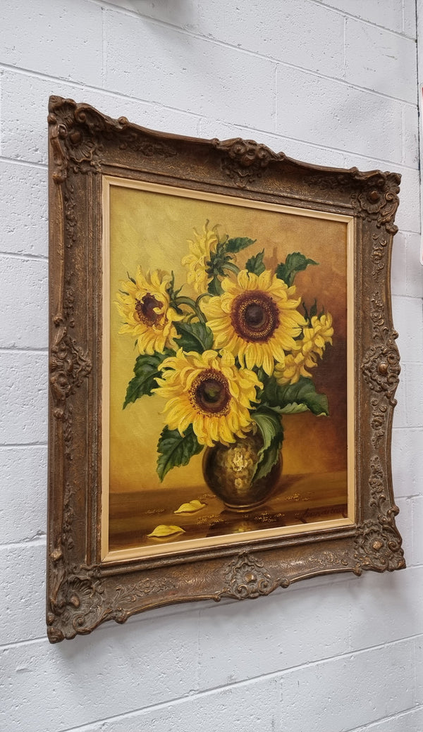 French signed oil on canvas depicting sunflowers in an attractive gilt frame. It is in good original detailed condition and has been sourced from France.