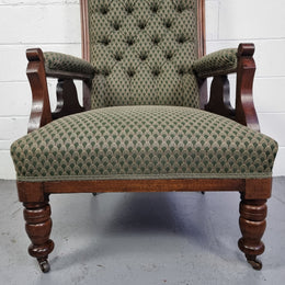 Pair of Edwardian button back Walnut armchairs. They are in good original condition with clean upholstery.