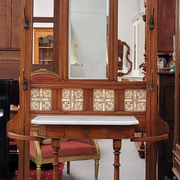 Late Victorian Arts and Crafts style marble top hall stand. Features three attractive tiles, original hooks and single drawer. In good original condition.