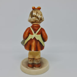 Gorgeous Hummel girl with watering can figurine, marked #74 . In great original condition.