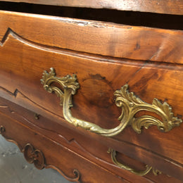 Beautiful 18th Century French all Cherrywood three drawer commode with beautiful ormolu mounts and handles. It is in good original detailed condition.