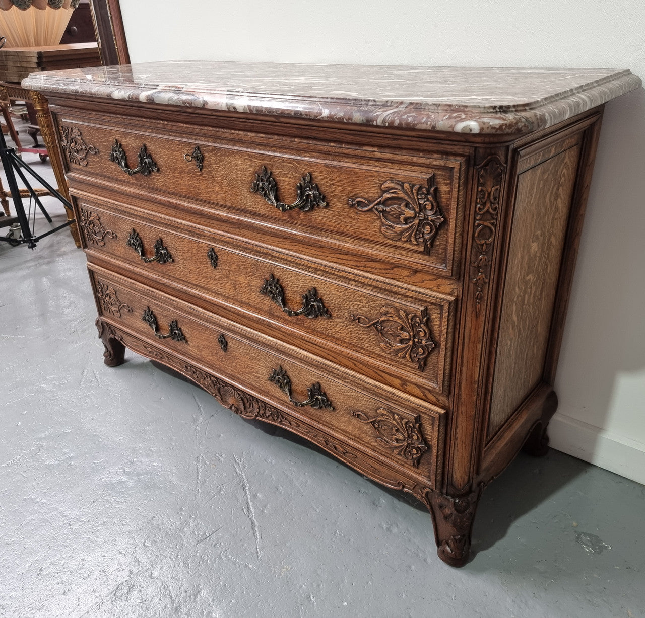 French Louis XV style three drawer Oak marble top commode. In good original detailed condition.