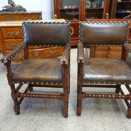 Here we have a fabulous set of six French oak rustic leather dining chairs with two carvers. Chairs are upholstered in brown leather and are very comfortable and solid. Is in very good original condition.