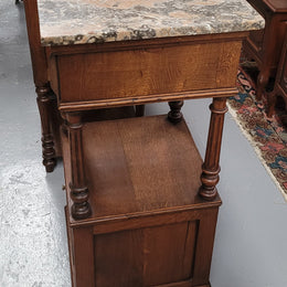 A Superb pair of Henry II style marble top French Antique bedside cabinets. They have a drawer at the top, an open shelf in the middle and a cupboard at the bottom. They have been sourced from France and are in good original detailed condition.