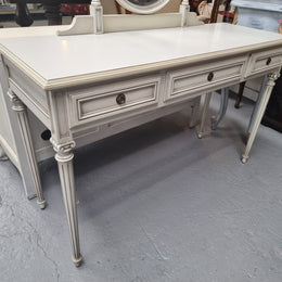 French Louis XVI style painted dresser / console with beveled oval mirror and three drawers. Sourced from France and in good original detailed condition.