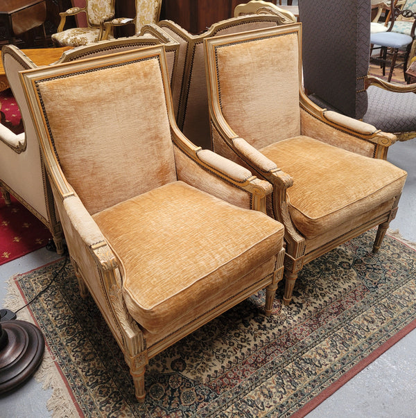 Pair of Louis XVI style painted arm chairs with carving & fluted legs. They have been sourced from France and the fabric is in good used original condition. Please view photos as they help form part of the description.