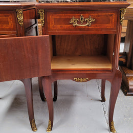 Appealing Louis XV style high quality bedside cabinets with black Portoro marble top and bronze mounts. They have been sourced from France and are in good original condition.