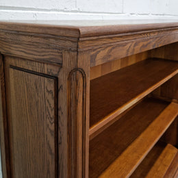 Lovely French Oak Louis XV style open shelf bookcase with two drawers for storage and three shelves in good original detailed condition.