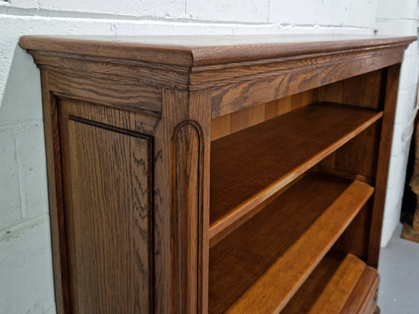 Lovely French Oak Louis XV style open shelf bookcase with two drawers for storage and three shelves in good original detailed condition.