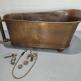 Sourced from France a rare full copper Antique bath tub on feet and includes an overflow, fittings, taps ect. In good original condition.