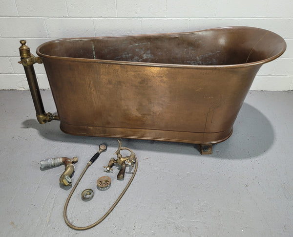 Sourced from France a rare full copper Antique bath tub on feet and includes an overflow, fittings, taps ect. In good original condition.