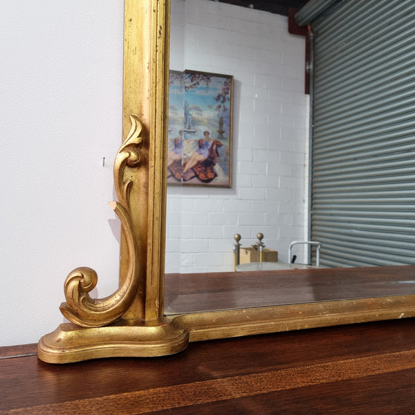 Antique arched over mantel gilt mirror. It has been sourced from France and is in good original detailed condition.