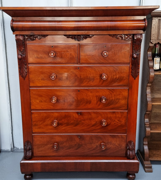 A 19th Century Scottish Flame Mahogany tall boy/ Chest of six drawers. Beautiful carvings and easily comes apart into three sections making transport o0r moving into place easy. In good original detailed condition.