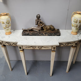 French Louis XVI style painted marble top console table. It is of pleasing narrow proportions and has been sourced from France. It is in good original detailed condition.