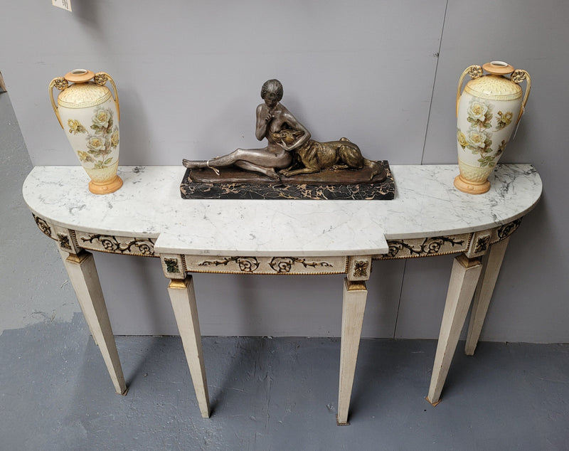 French Louis XVI style painted marble top console table. It is of pleasing narrow proportions and has been sourced from France. It is in good original detailed condition.