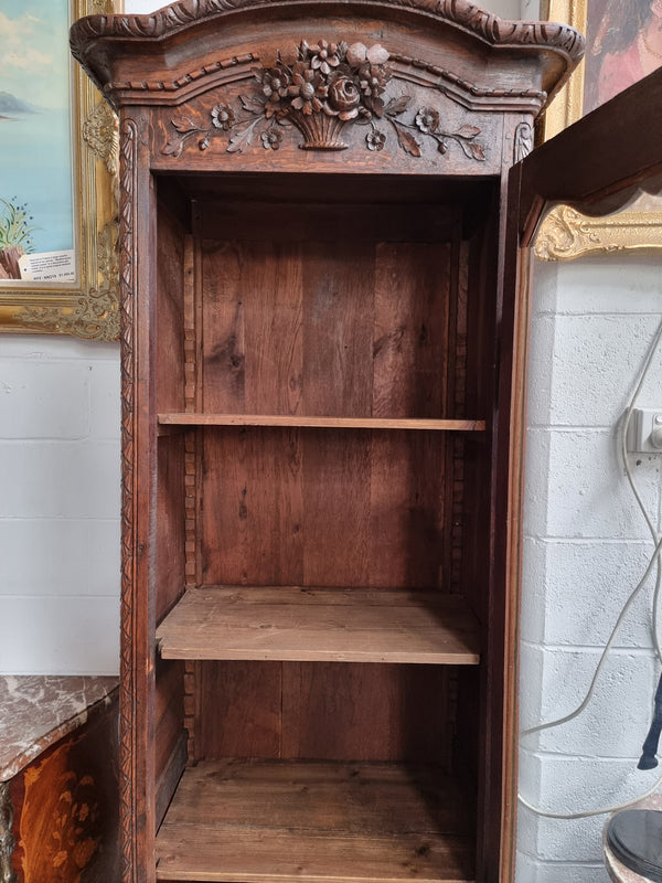 Petite oak armoire display cabinet with a glass door, two drawers at the bottom and three shelves inside. Late 18th Century and amazing detailed decorative carvings. Sourced from France and in good original condition.