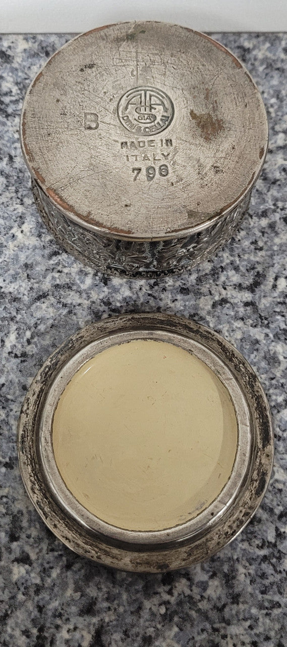 Unusual Antique silver over pottery Italian trinket box nicely decorated with Cherubs. It is in good original condition, please view photos as they help form part of the description.