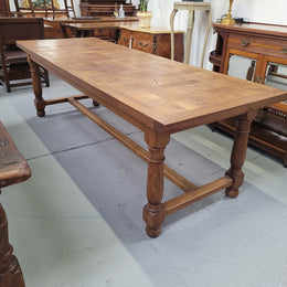 French Oak Refectory dining table with a parquetry top. Sourced from France this table comfortably sits eight to ten. It is in good original detailed condition.